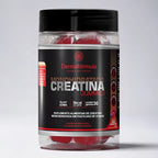 Dermafórmula Melhor Farmácia de Manipulação em Santos | Frasco cilíndrico transparente exibindo gomas vermelhas em seu interior. O rótulo preto destaca os textos 'Creatina Gummies', '3g por goma' e '5kcal por goma' em branco e vermelho. No canto inferior direito, uma ilustração de frutas vermelhas indica o sabor. Logotipo Dermafórmula em destaque no centro.